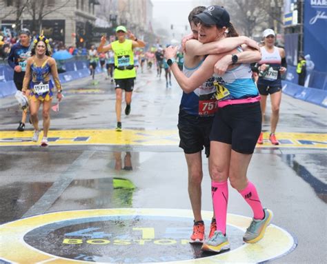 ‘It’s a beautiful thing’ Thousands unite, run and cheer during a rainy, cool marathon